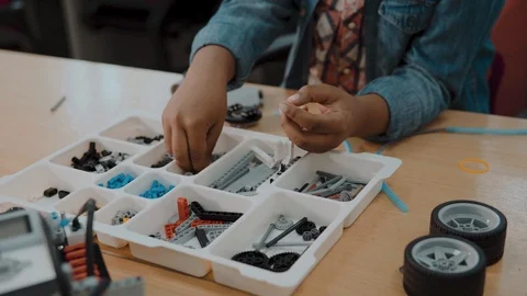 Little boy in robotics school makes robot. Afro-american young schoolboy Video stock 112876031