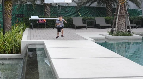 Little boy run cross over water swimming pool Stockbeeldmateriaal 45632886