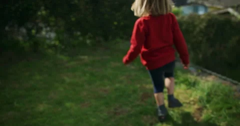 Little boy running and playing on the lawn Stock Footage 133124589