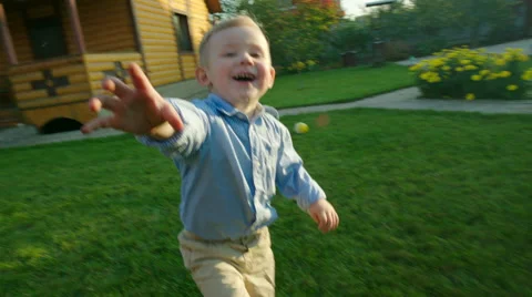 Little Boy Running for the Camera Stock Footage 56250884