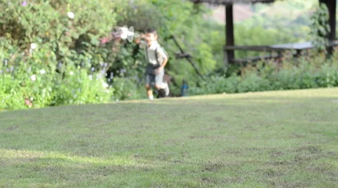 Little boy running playing kite in the hill Stockbeeldmateriaal 40468320