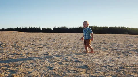 Little boy running on sand Stock Footage 65763829