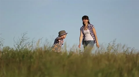 A little boy runs away from mom and dad,... | Stock Video | Pond5