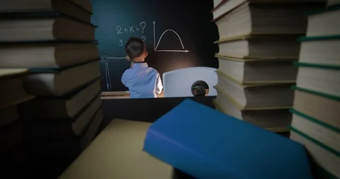 A little boy at the school board solves equations Stock Footage 86555829