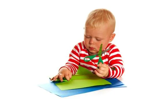 Little boy with scissors Stock Photos
