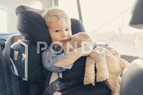 Little Boy Sitting In Back-Seat Car Seat