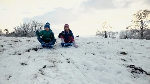 Little boy sledging in the wintertime Stock Footage 88494964