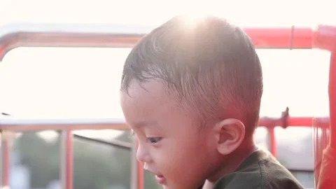 Little boy smiling to camera in the sunset at evening time Stock Footage 157591367