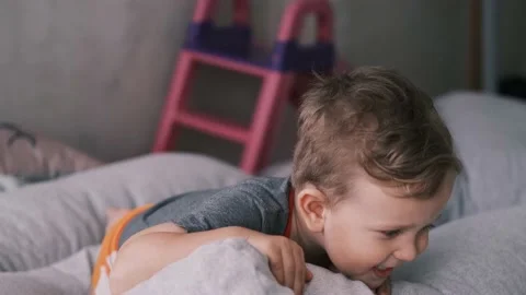 Little boy smiling while looking into the camera. Stock Footage 150590767