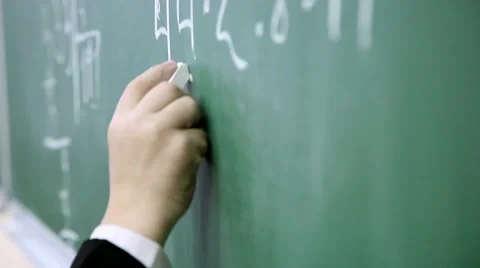 Little boy solves math on the blackboard at school 5 Stock Footage