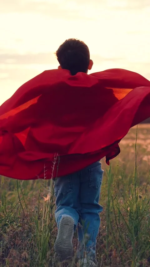 Little boy son running through park sunset superhero costume, child kid dream Stock Footage 280348352