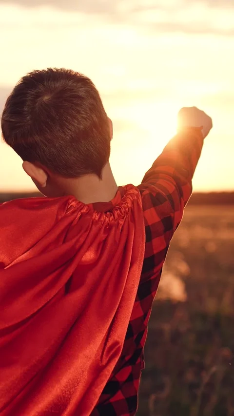 Little boy son running through park sunset superhero costume, child kid dream Stock Footage 295252677