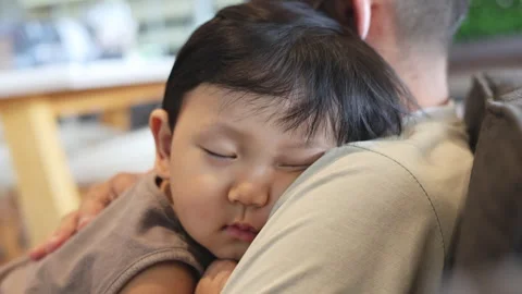 Little  Boy Speeping On His Dad Shoulder Video stock 253489352