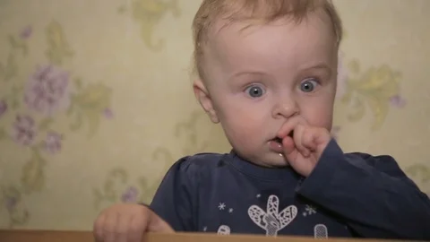 A little boy standing in cot Stock Footage