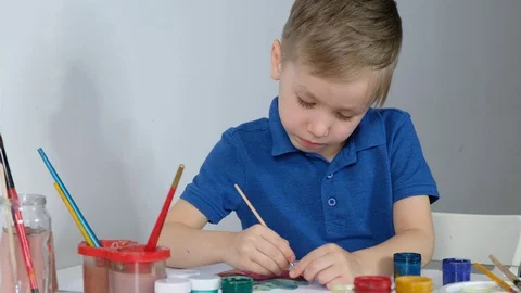 Little boy study online drawing with his mother via internet looking at laptop Stock Footage 128383243