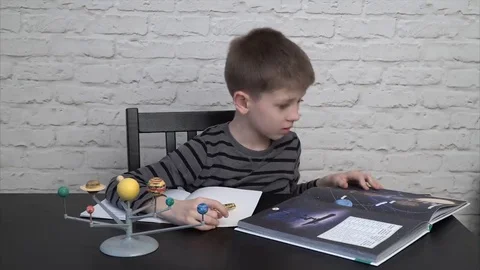 Little boy studying astronomy Stock Footage 69216980