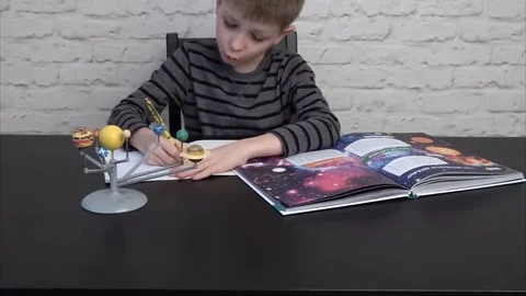 Little boy studying astronomy Stock Footage 69217035