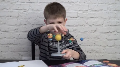Little boy studying astronomy Stock Footage 69217099