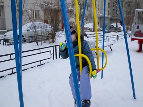 Little boy swinging on a swing Stock Footage 73356692