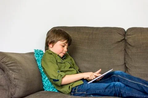 Little boy with tablet Stock Photos