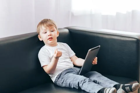 Little boy with a tablet Stock Photos