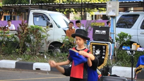 Little boy taught magic by an old man Stock Footage 286289501