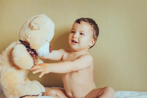 Little boy with teddy bear Stock Photos