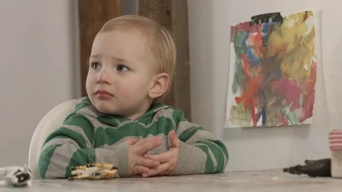 The little boy thinks while he is being served a cocktail. 動画素材 74971737