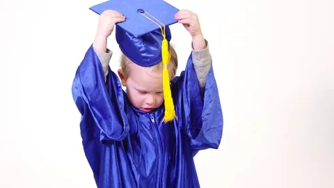 Little boy throwing graduation hat into air Stock-Footage 80127142
