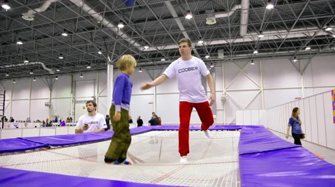 Little boy training on trampoline Stock Footage 45847444