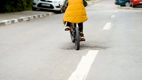 Little boy try to avoid a obstacle on the road . Stock Footage 129512325