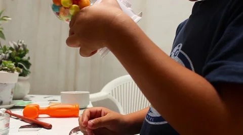 Little boy trying to pull candy Stock Footage 65301693