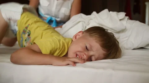 Little boy trying to wake up Stock Footage 52429945