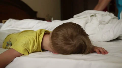 Little boy trying to wake up Stock Footage 52430018
