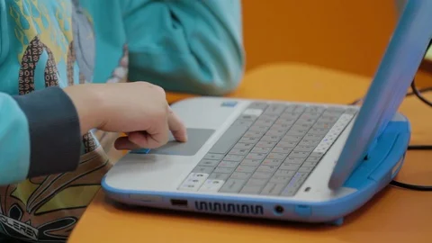 Little boy typing on laptop at kindergar... | Stock Video | Pond5