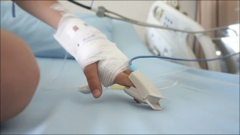 Little boy use a Finger Pressure Oximeter Finger Clip in hospital Stockbeeldmateriaal 101932018