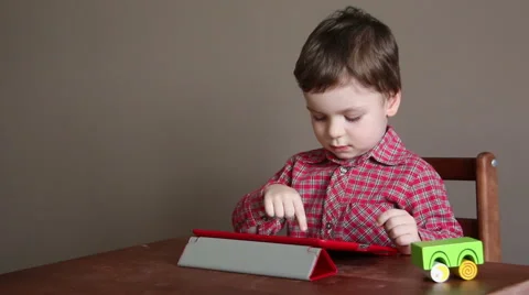Little Boy Uses the Tablet Stock Footage 66252197