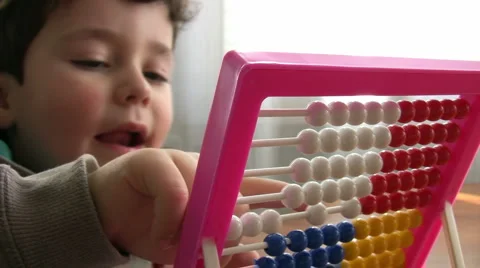 Little Boy using abacus Stock Footage 1060481