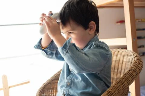Little boy using a digital thermometer Stock Photos