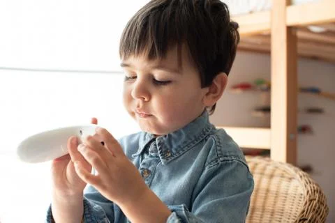 Little boy using a digital thermometer Stock Photos
