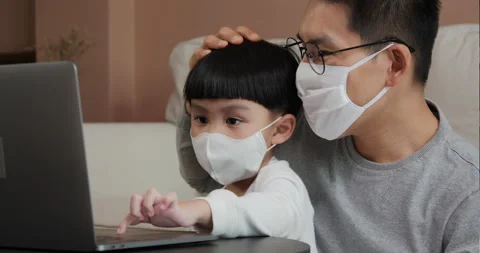 Little boy using laptop and father take care of him at home. Stock Footage 131893515