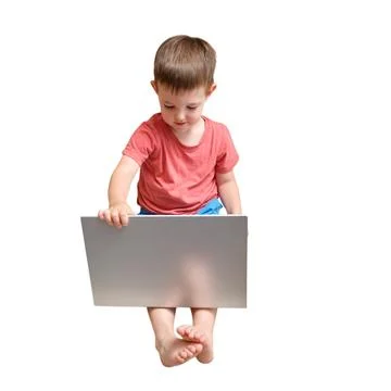 Little boy using laptop computer on white background. Child learning with dig 库存照片