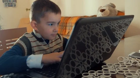 Little boy is using a laptop Stock Footage 86644205