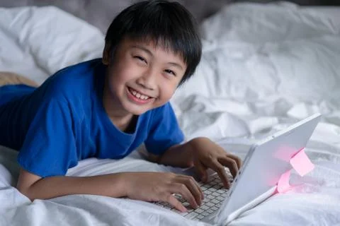 Little boy using laptop learning for education online Stock Photos