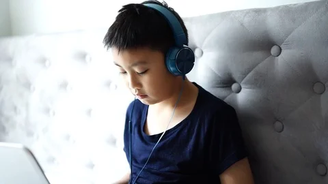 Little boy using laptop play game at home for relax Stock Footage 102496651