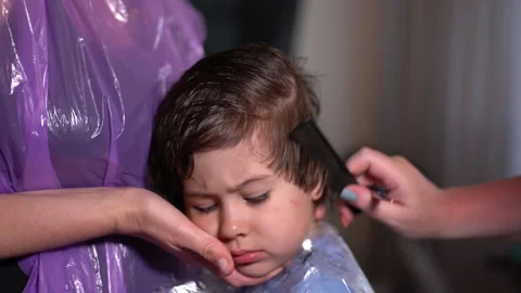 Little boy using scissors at home, portr... | Stock Video | Pond5