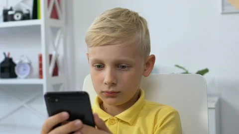 Little boy using smartphone at home, gadget addiction, technology influence Stock-Footage 119035747