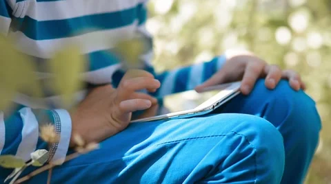 Little Boy Using Tablet Computer Outdoor Stock Footage 54933256