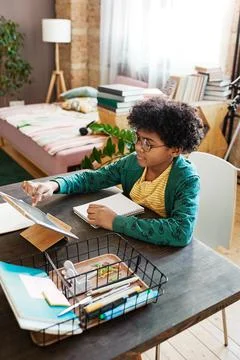 Little boy using tablet pc for studying Stock Photos
