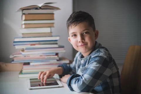 Little boy is using a tablet. Stock Photos